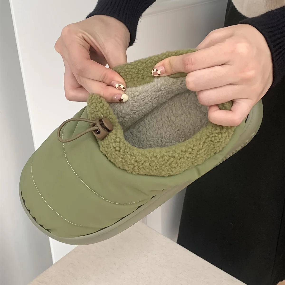 Cozy fuzzy winter slippers for women and men with soft EVA sole warm fabric lining indoor outdoor use casual style drawstring