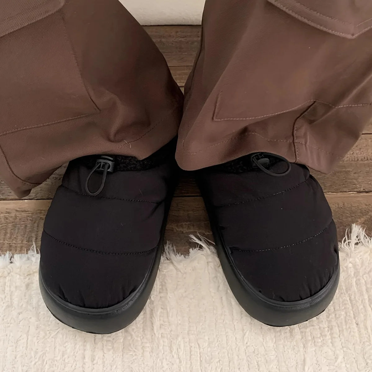 Cozy fuzzy winter slippers for women and men with soft EVA sole warm fabric lining indoor outdoor use casual style drawstring